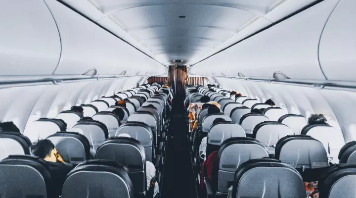 photo of passenger rows inside an airplane