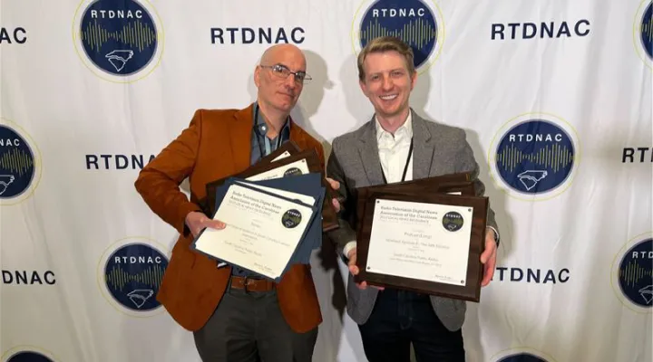 image of scott morgan and sean birch holding awards