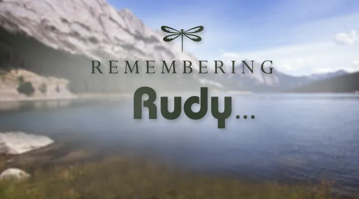 remembering rudy written with lake in background