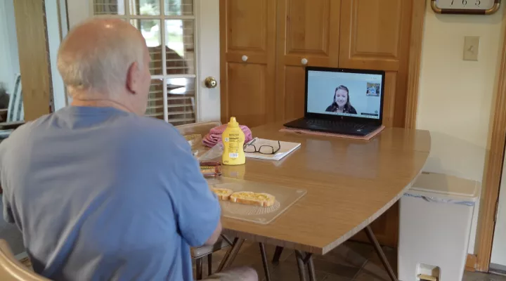 Jack Gaddy speaks with his occupational therapist during a telerehabilitation session.