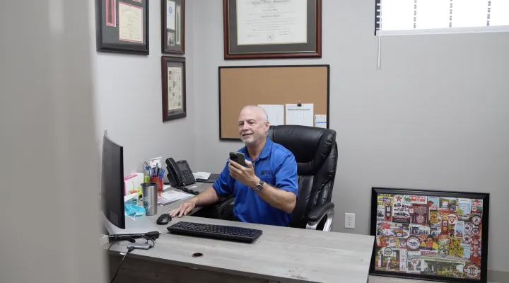 Dr. Abe Moskow provides a phone consultation to a primary care provider. 