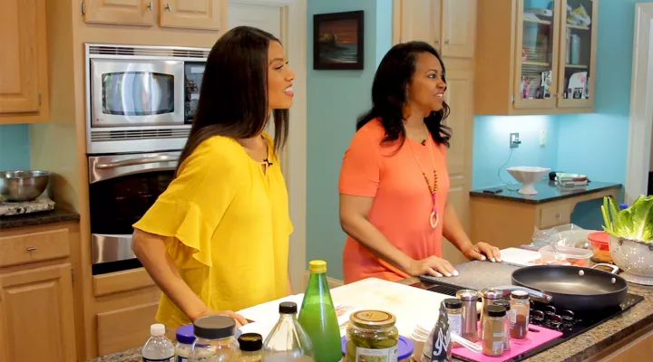 Photo of Michelle Reed Harper and Donna Jenkins in the kitchen.