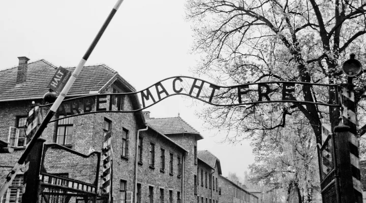 The gate at Auschwitz concentration camp, with the slogan "work will set you free" above the entrance.  