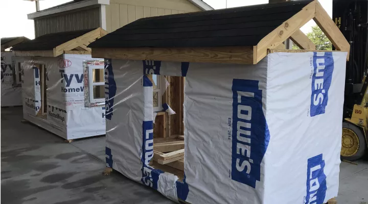 Students in the BOOM Program learned construction techniques by building small houses. 