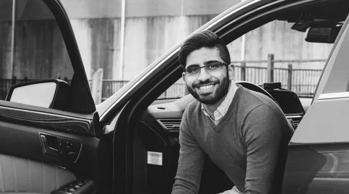 Kiran Ravindra sitting in the car