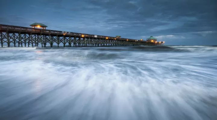 South Carolina pier at the ocean with swelling tides