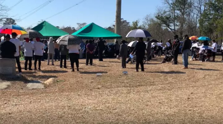 mourners at funeral