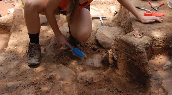 Junior Carson King works in the open trench at Fort Hill on June 19, 2019.