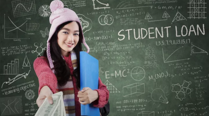 girl at chalkboard with money