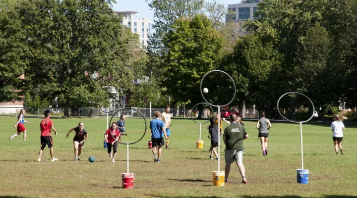 young students playing the game Quidditch