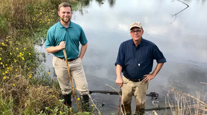 two men by a pond