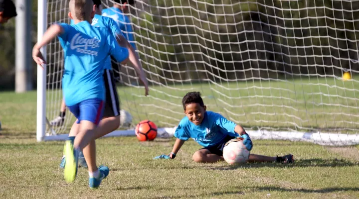 12-year-old Justin Ruiz makes a save during soccer practice. Ruiz suffers from sickle cell disease.