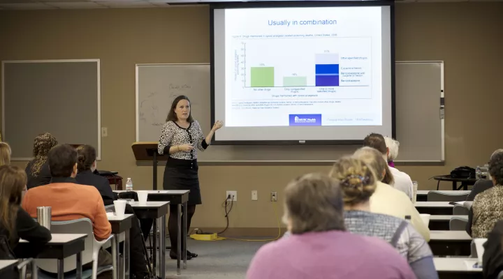 Dr. Kelly Barth addressing a group of addiction specialists in Florence, South Carolina.