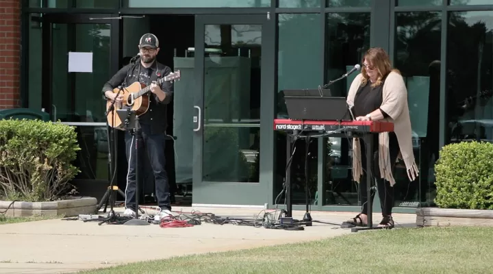 Musicians playing outside church doors