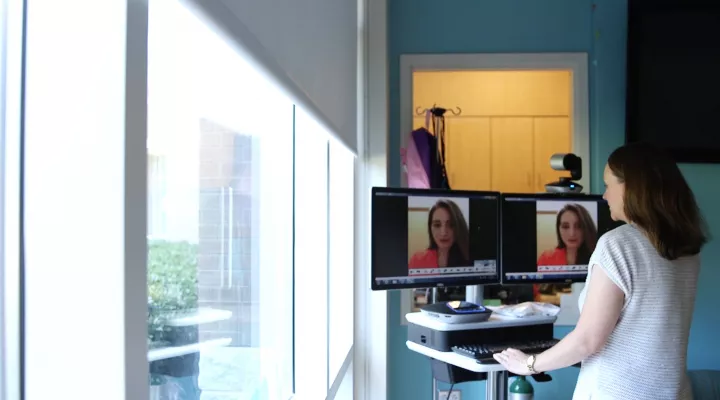 Provider demonstrates how she uses a telehealth cart.