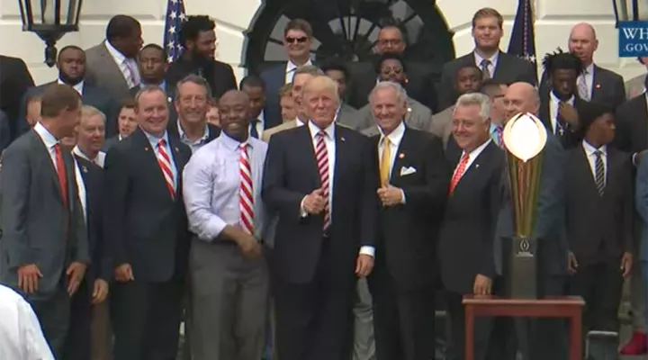 President Donald Trump stands with Clemson football team and South Carolina politicians at the White House on June 12, 2017.