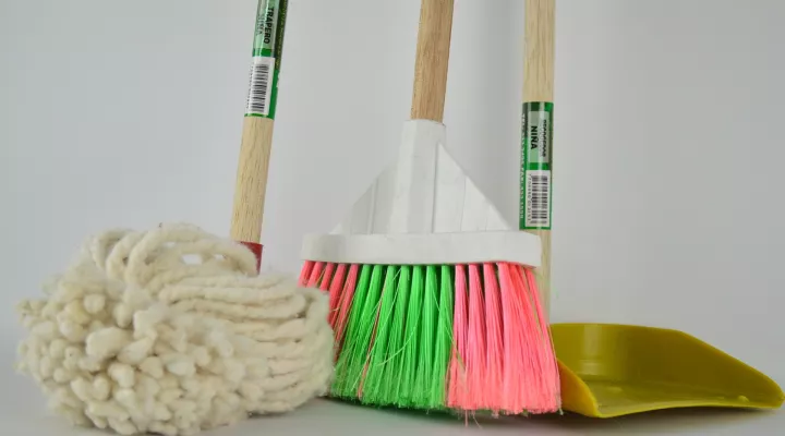 photo of a mop, broom and dustpan