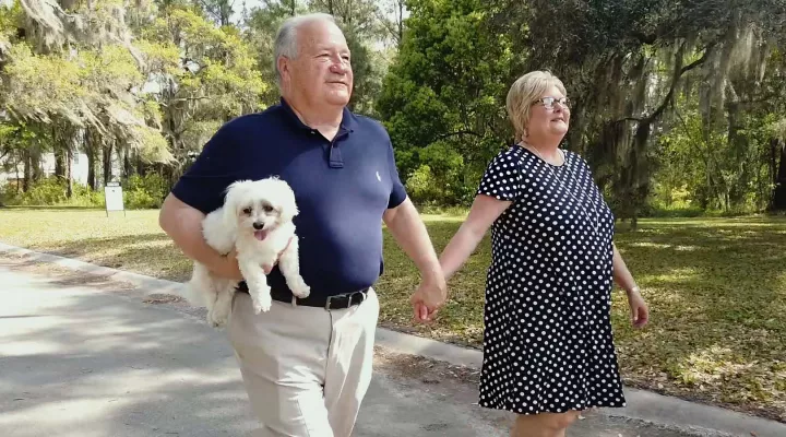 Tommy Cox and his wife walk in Georgetown, SC