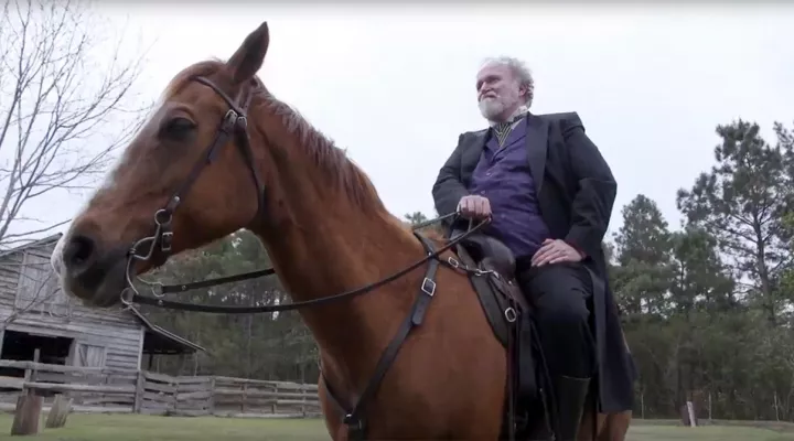 White landowner on horse