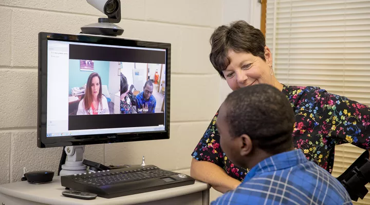 Nurse practitioner Kelli Garber consults with a patient through telehealth at C.E. Murray High School in Williamsburg County.