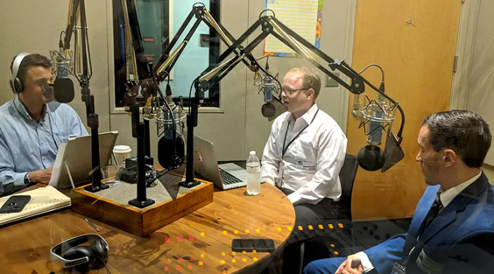 Gavin Jackson (l) speaks with Jamie Lovegrove and Andy Brown (r) on Thursday, June 28, 2018.