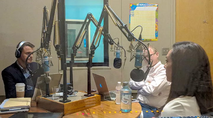 Gavin Jackson (l) speaks with Jamie Lovegrove and Meg Kinnard (r) in the South Carolina Public Radio studios.