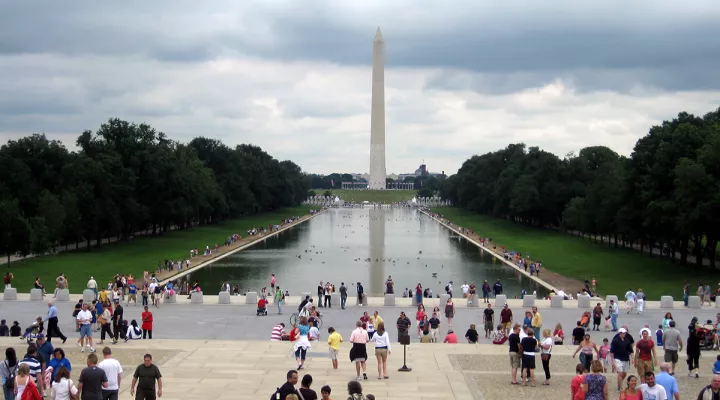 A view of the Washington Monument across the reflecting pool in front of the Lincoln Memorial.