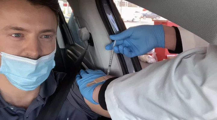 Gavin Jackson receives his first dose of the Moderna COVID-19 vaccine at McLeod Health's mass vaccination site site at Darlington Raceway on March 5, 2021. Jackson became eligible when Gov. Henry McMaster and SCDEHC move the state to Phase 1B and McLeod was granted an exemption to include Phase 1B patients in their clinic.