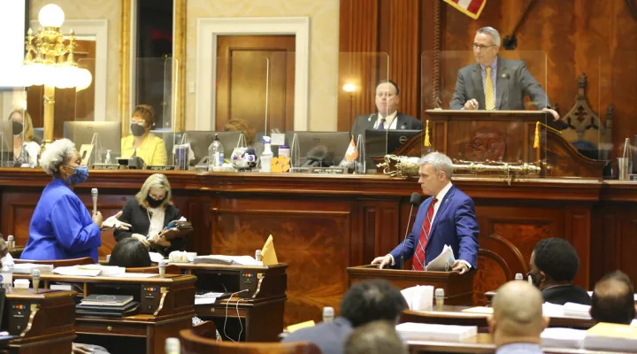 South Carolina Rep. Tim McGinnis, R-Myrtle Beach, right, discusses a bill requiring high schools and colleges to provide more lessons on the U.S. Constitution with Rep. Wendy Brawley, D-Hopkins, left, on Wednesday, April 14, 2021, in Columbia, S.C. House members agreed to take more time before continuing to debate the proposal. (AP Photo/Jeffrey Collins)