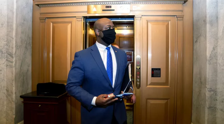 FILE - In this Feb. 13, 2021, file photo, Sen. Tim Scott, R-S.C., departs Capitol Hill in Washington. Scott will deliver Republicans’ rebuttal to President Joe Biden’s joint address to Congress. (Stefani Reynolds/Pool via AP, File)