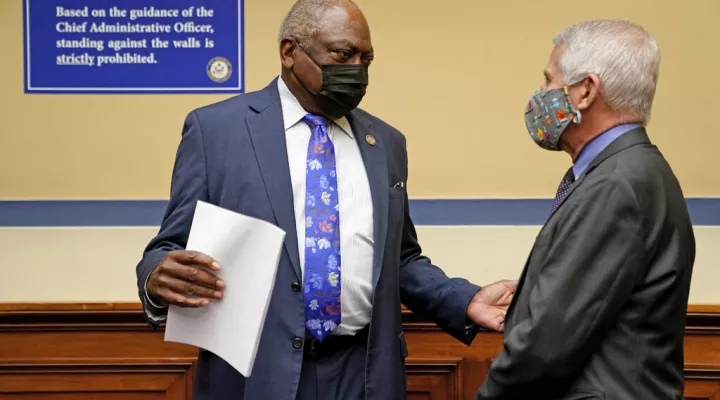 Dr. Anthony Fauci, director of the National Institute of Allergy and Infectious Diseases, speaks with Rep. Jim Clyburn, D-S.C., before a House Select Subcommittee on the Coronavirus Crisis on the Capitol Hill in Washington, Thursday, April 15, 2021. (Amr Alfiky/The New York Times via AP, Pool)