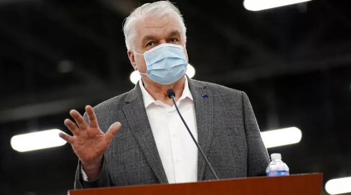 FILE - In this April 29, 2021, file photo, Nevada Gov. Steve Sisolak speaks during a news conference in Las Vegas. Gov. Sisolak applauded Nevada lawmakers for passing hundreds of bills in a legislative session colored heavily by the coronavirus pandemic. In an interview with reporters Tuesday, June 1, 2021, Sisolak said he felt optimistic about the state's future. (AP Photo/John Locher, File)