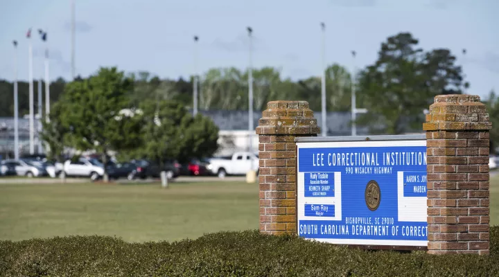 FILE - This Monday, April 16, 2018, file photo, shows a sign outside the Lee Correctional Institution in Bishopville, S.C. (AP Photo/Sean Rayford, File)