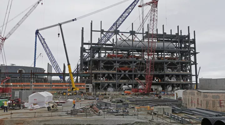 FILE - In this Sept. 21, 2016, file photo, V.C. Summer Nuclear Station's unit two's turbine is under construction near Jenkinsville, S.C., during a media tour of the facility. Investors who lost fortunes in the failure of the multi billion-dollar nuclear reactor construction deal in South Carolina will soon begin to see their portions of a $192 million settlement, under a recently approved distribution. Last week, a federal judge signed off on a plan to disperse the funds among former shareholders in SCANA…