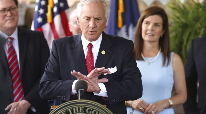 FILE - In this June 24, 2021, file photo, South Carolina Gov. Henry McMaster speaks during a ceremony to sign a bill preventing people from suing businesses over COVID-19 on Thursday, at Cafe Strudel in West Columbia, S.C.  McMaster is one of several Republican state leaders opposing federal efforts to go door-to-door to urge people to get vaccinated against COVID-19. (AP Photo/Jeffrey Collins, File)