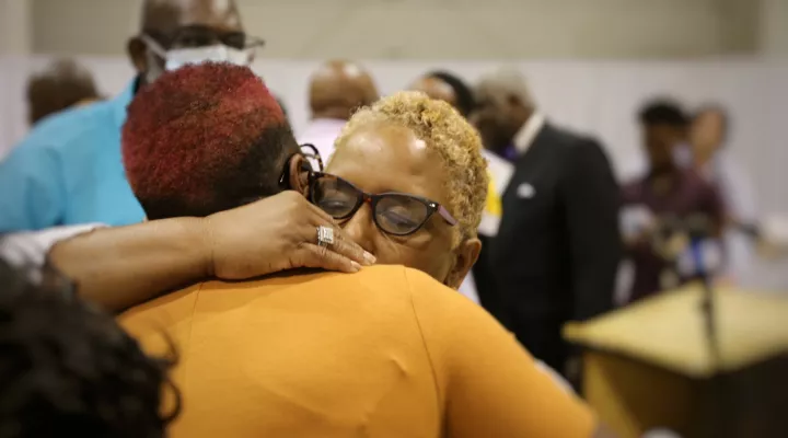  Jamal Sutherland's mother Amy hugs supporters following a press conference at the New Life Center in North Charleston after Ninth Circuit Solicitor Scarlett Wilson announces charges will not be filed against Charleston County detention officers involved.