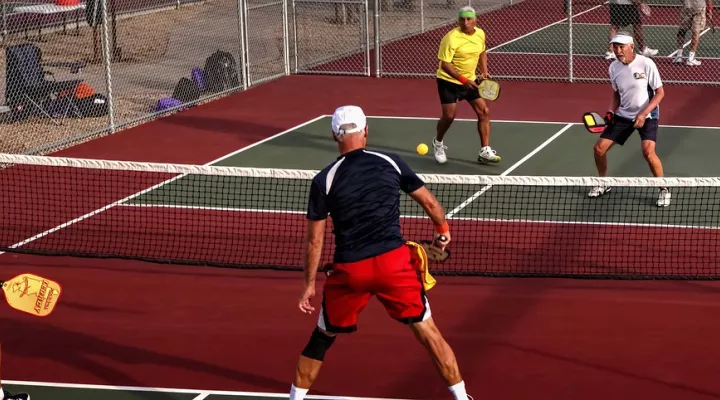  Invented by golf fathers to occupy bored children, pickleball has grown into a game for all ages.
