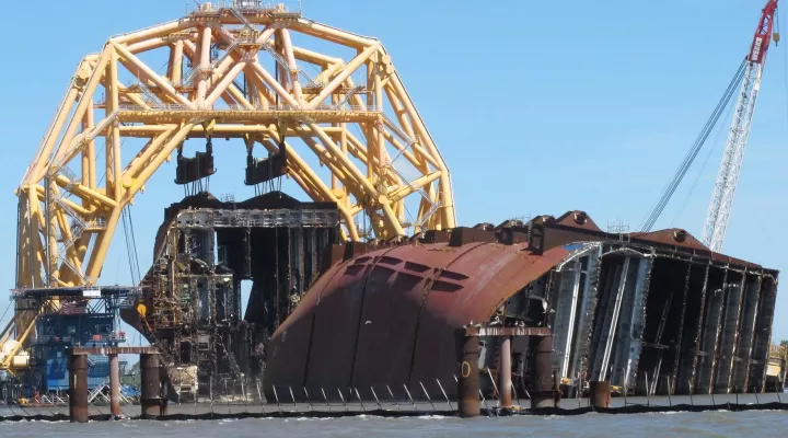 FILE - In this April 26, 2021 file photo, a towering crane pulls the engine room section away from the remains of the capsized cargo ship Golden Ray offshore of St. Simons Island, Ga.  Accounts contained in crew member interviews are among more than 1,700 pages of documents made public Thursday, July 29, by the National Transportation Safety Board. The Golden Ray, carrying more than 1,400 vehicles, overturned after leaving the Port of Brunswick along the Georgia coast on Sept. 8, 2019. Tennant and about tw…