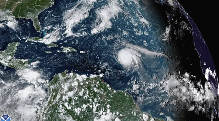 This satellite image provided by the National Oceanic and Atmospheric Administration shows Hurricane Sam, just right of center, in the Atlantic Ocean, Monday, Sept. 27, 2021, at 1920 Zulu (3:20 p.m. ET). Sam is a powerful Category 4 storm but it poses no threat to land as it loops northward in the Atlantic, according to the U.S. National Hurricane Center. (NOAA via AP)