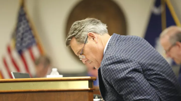 South Carolina Sen. Ross Turner, R-Greenville, looks over documents on a proposed $2 billion tax cut and rebate bill on Thursday, March 3, 2022, in Columbia, S.C. (AP Photo/Jeffrey Collins)