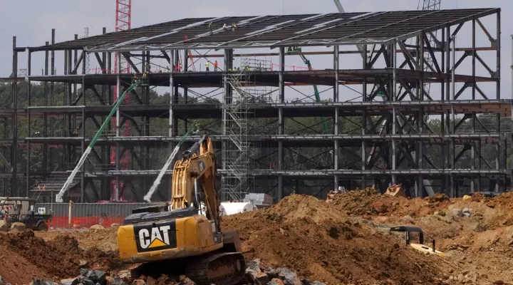 FILE - Construction personnel work on the Carolina Panthers' state-of-the-art team headquarters and practice facility Aug. 24, 2021, in Rock Hill, S.C. Panthers owner David Tepper has paused construction on the team’s $800 million practice facility in Rock Hill, citing concerns over a lack of funding from the city that is needed to complete the project’s infrastructure. (AP Photo/Chris Carlson, File)