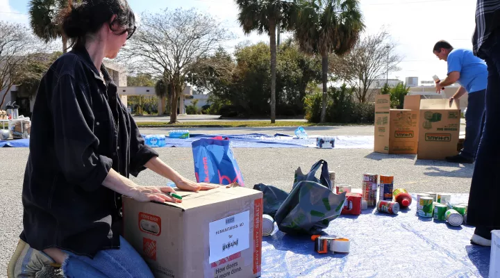 Maka Aptsiauri collects donations for people in Ukraine at a parking lot across the street from her business Euro Foods Cafe and Bakery in West Ashley.