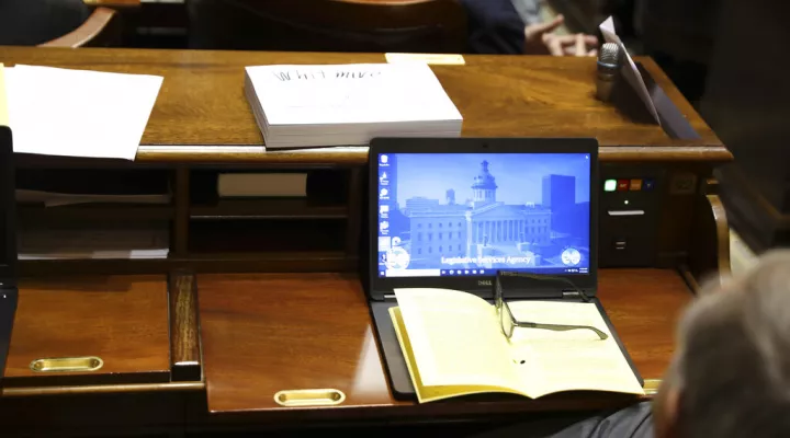 The 2022-23 South Carolina budget sits on the desk of state Rep. Bill Whitmire, R-Walhalla, on Thursday, March 10, 2022, in Columbia, S.C. (AP Photo/Jeffrey Collins)