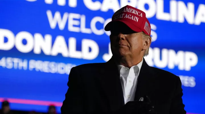 Former President Donald Trump arrives at a rally, Saturday, March 12, 2022, in Florence, S.C. Trump has endorsed two Republicans mounting primary challenges to sitting House members who have been critical of him. (AP Photo/Meg Kinnard)