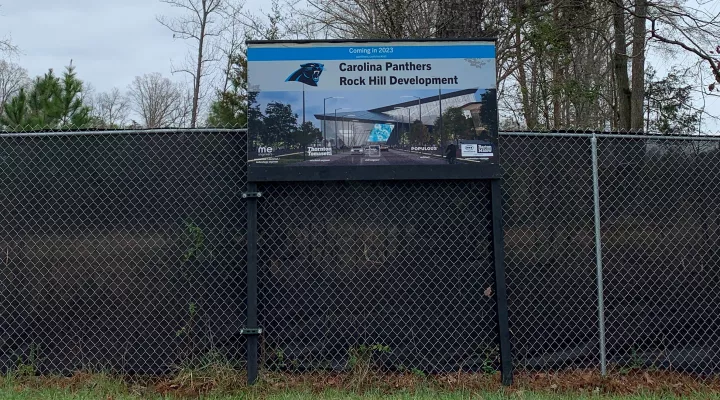  Work at the Carolina Panthers' new practice/HQ site in Rock Hill is quiet as officials and team representatives hammer out money issues.