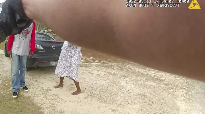 In this image from the body camera video of Richland County Sherrif's Deputy John Anderson, Irvin D. Moorer Charley, 34, holds a piece of wood as he walks towards Anderson, who is backpedaling, in Columbia, S.C. Moorer Charley was shot and killed after deputies responded to a call about domestic violence. (Deputy John Anderson/Richland County Sheriff's Department via AP)