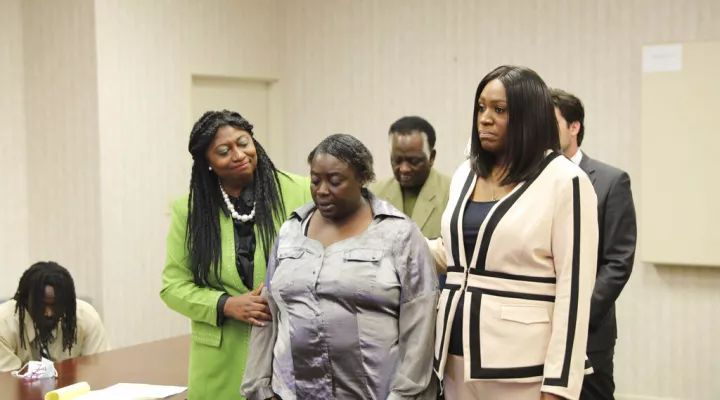 Connie Craig, center, talks about the death of her son, Irvin D. Moorer Charley, who she saw shot and killed by a Richland County deputy during a news conference in Columbia, S.C., Wednesday, March 23, 2022. (AP Photo/Jeffrey Collins)