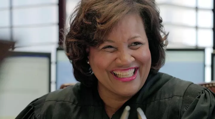 FILE - U.S. District Judge J. Michelle Childs smiles as she works in her chambers on Friday, Feb. 18, 2022, at the federal courthouse in Columbia, S.C. Childs, the South Carolina federal judge recently under consideration for a slot on the U.S. Supreme Court, has been named recipient of the Outstanding Contribution to Justice Award, the South Carolina Association for Justice announced Monday, April 4. (AP Photo/Meg Kinnard, File)