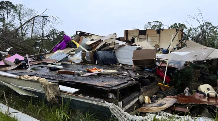 Damage is seen at a house on South Main Street in Pembroke, Ga., 30 miles from Savannah, after a storm passed through the city, Tuesday, April 5, 2022. (AP Photo/Lewis Levine)