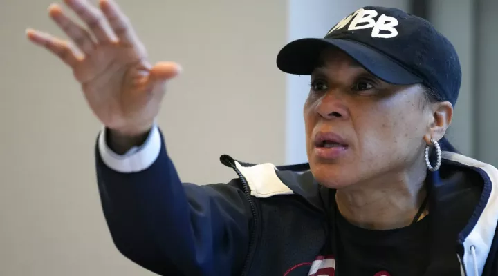 South Carolina head coach Dawn Staley speaks to her team during a film session at the Women's Final Four NCAA college basketball tournament, Saturday, April 2, 2022, in Minneapolis. The players found ways to enjoy their time in Minneapolis preparing for the women's Final Four and a shot at a second national title. (AP Photo/Charlie Neibergall)